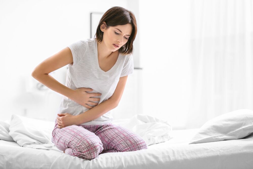 Bauchschmerzen als Symptom für das Vorhandensein von Parasiten.